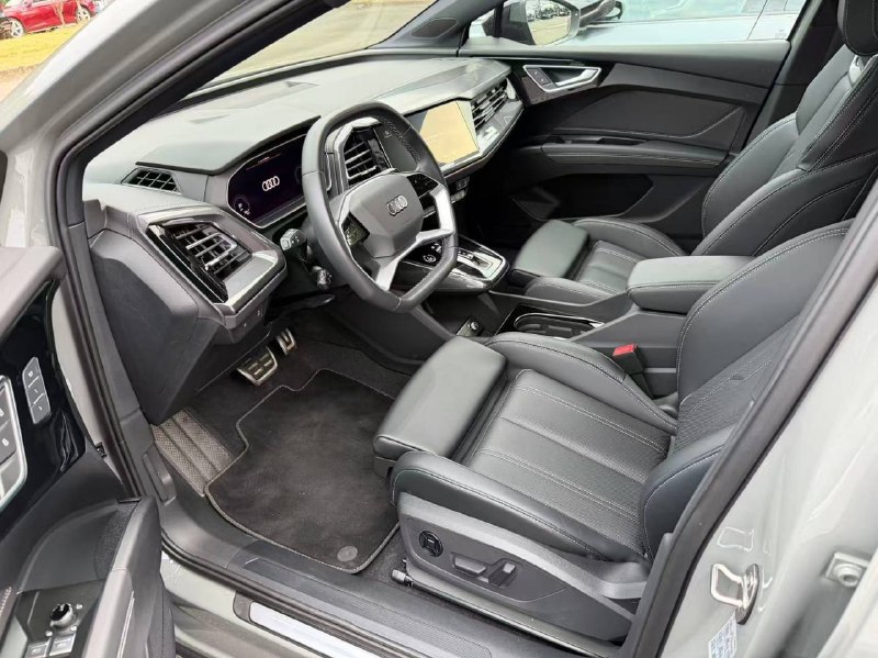 Audi Q4 e-tron 50 quattro 2023: немецкий электромобиль вместо китайского Audi Q4 e-tron 50 quattro 2023: немецкий электромобиль вместо китайского